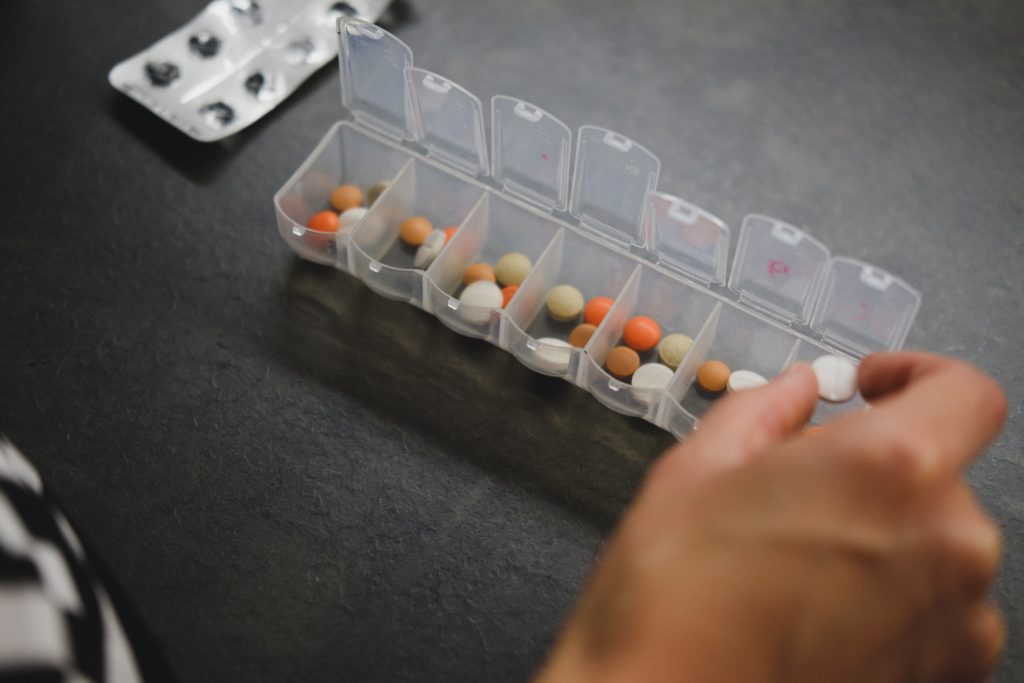 Sorting pills into pill holder
