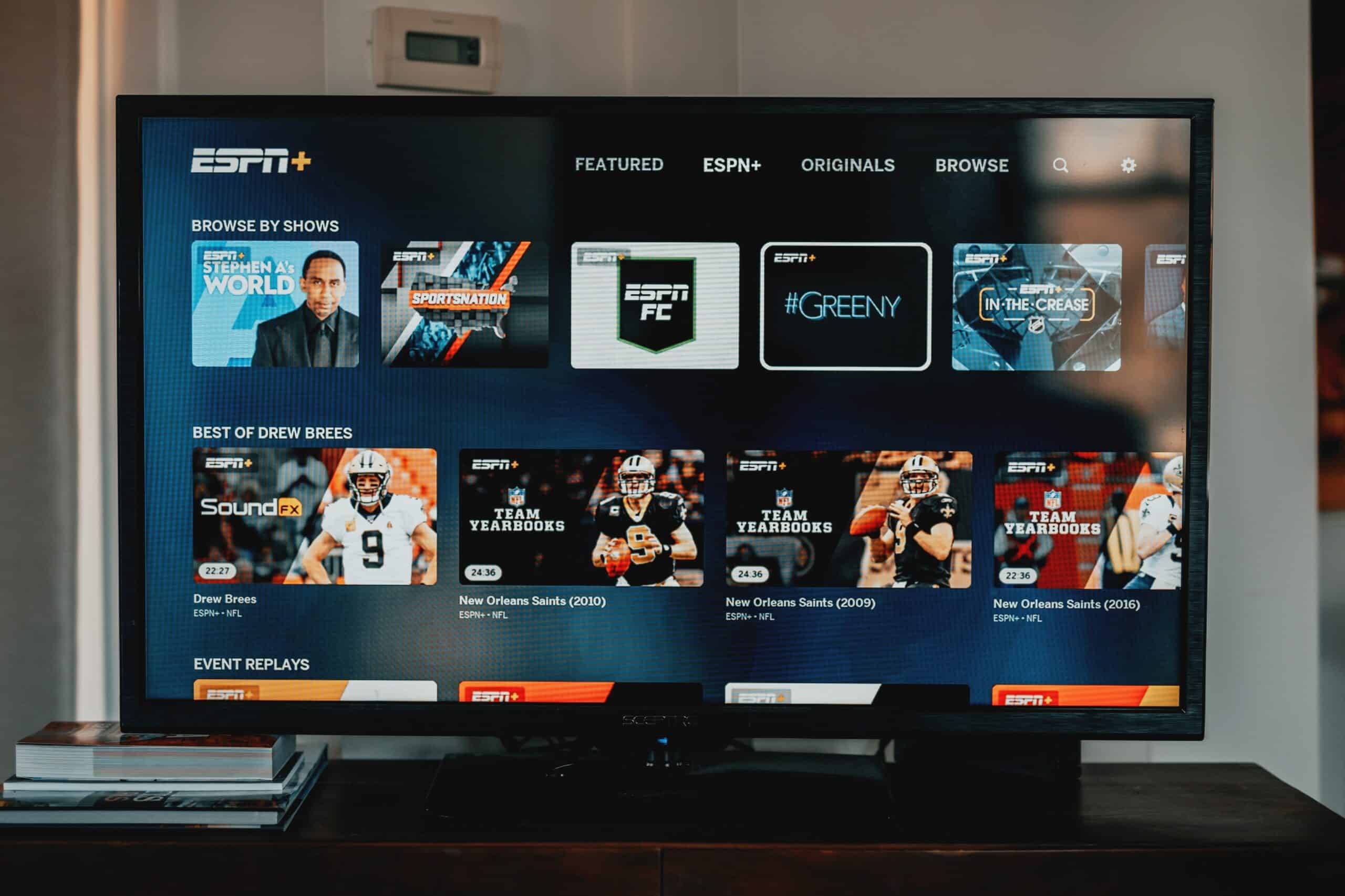 Image of flatscreen tv on with ESPN+ home screen on the screen