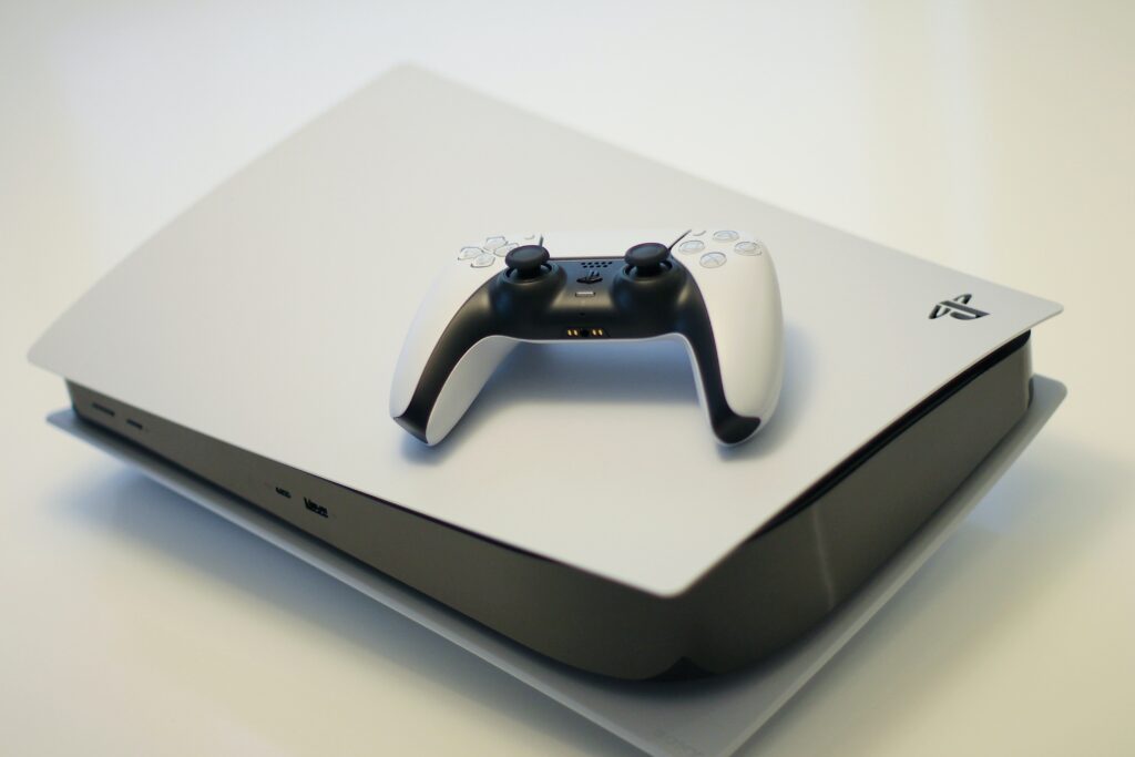 Image of PlayStation 5 Console and control on top of the console