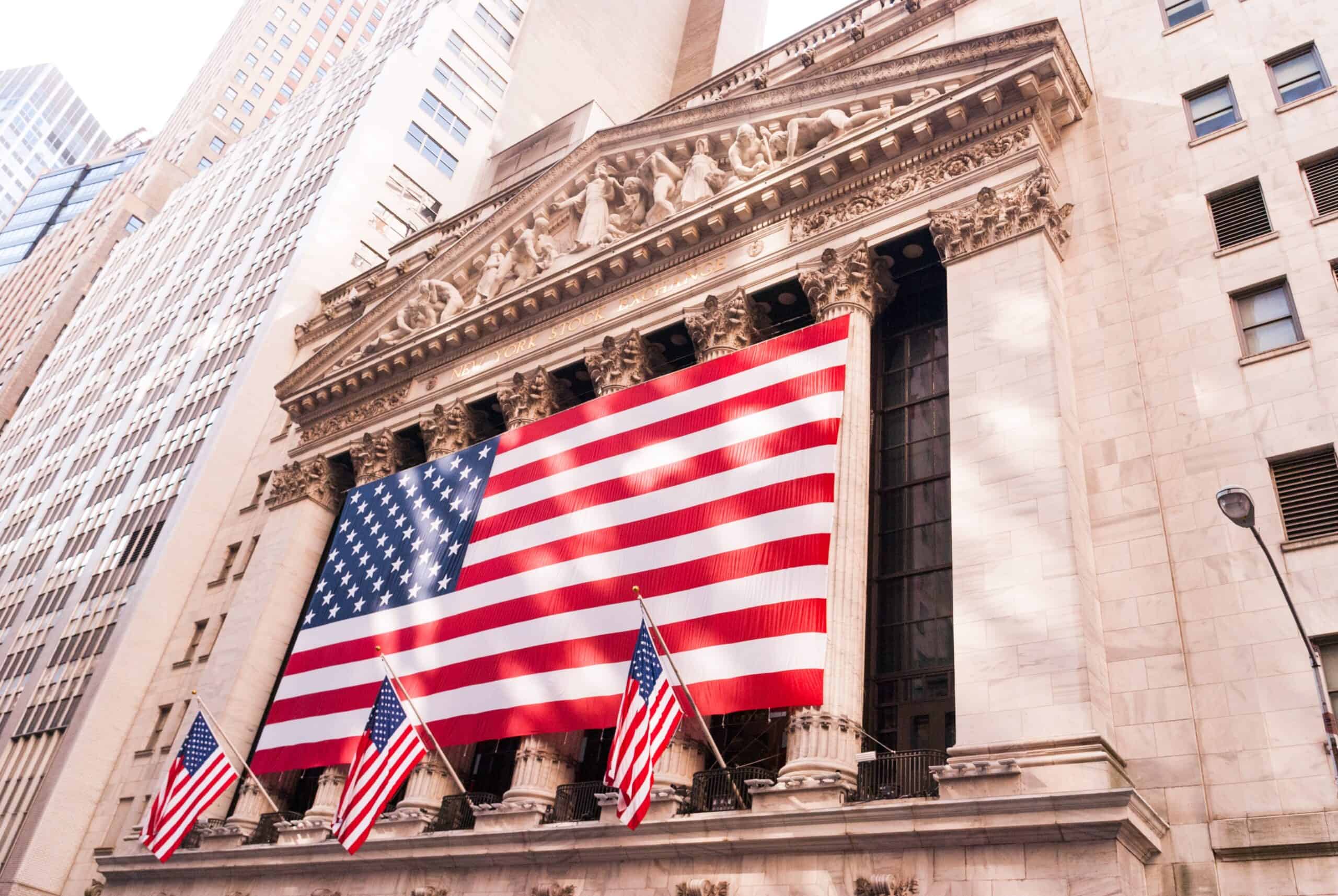 Image of New York Stock Exchange building draped in American flags