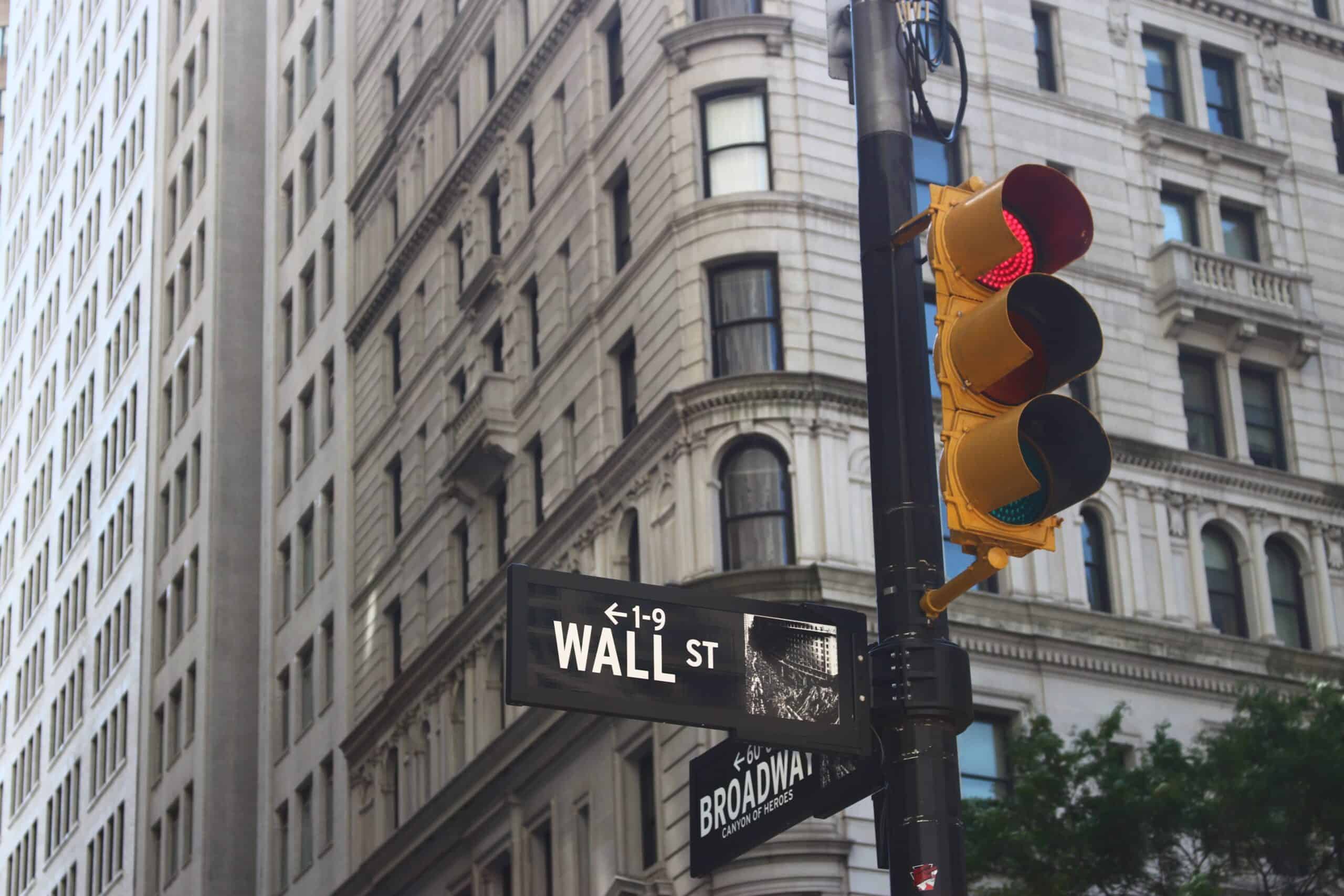 Wall street sign mounted on traffic light