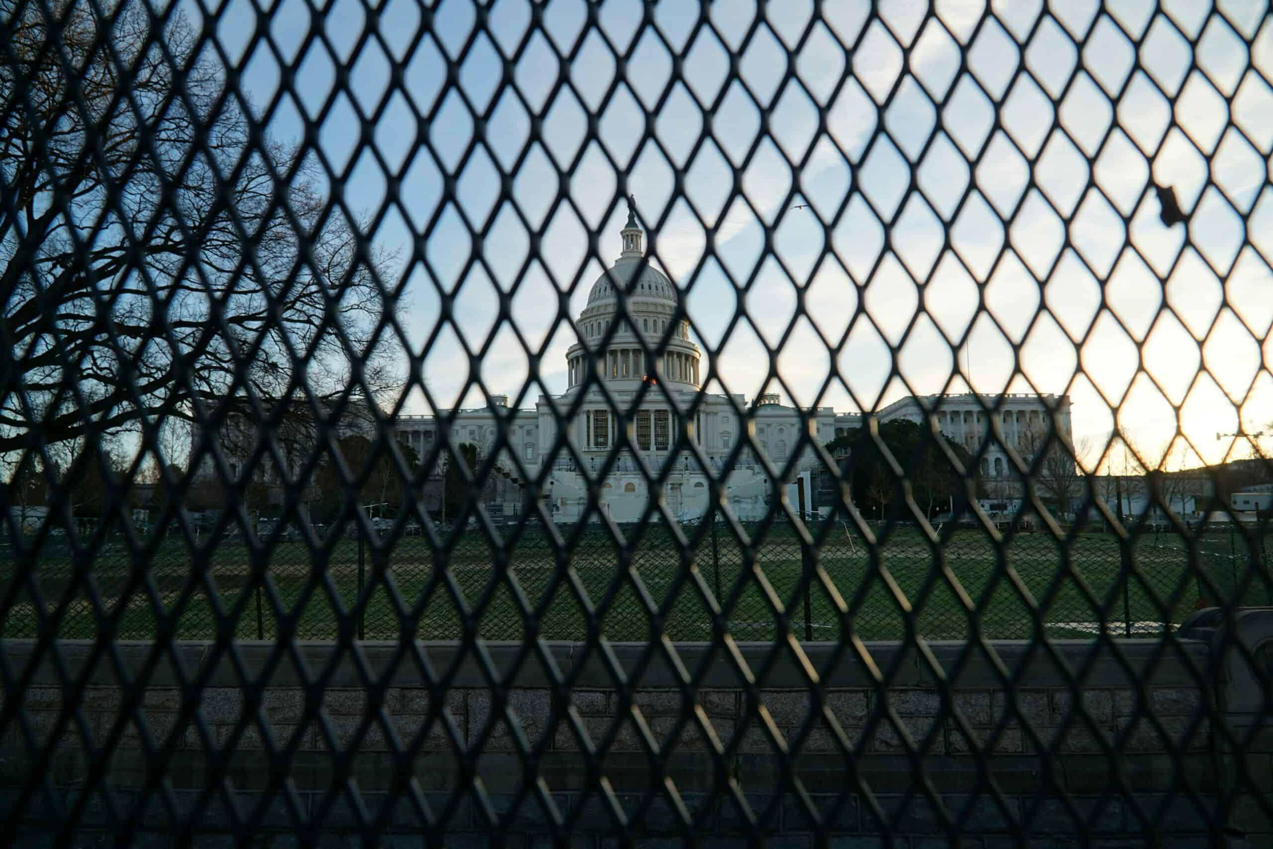 Looking at U.S. Capitol Building through black fence