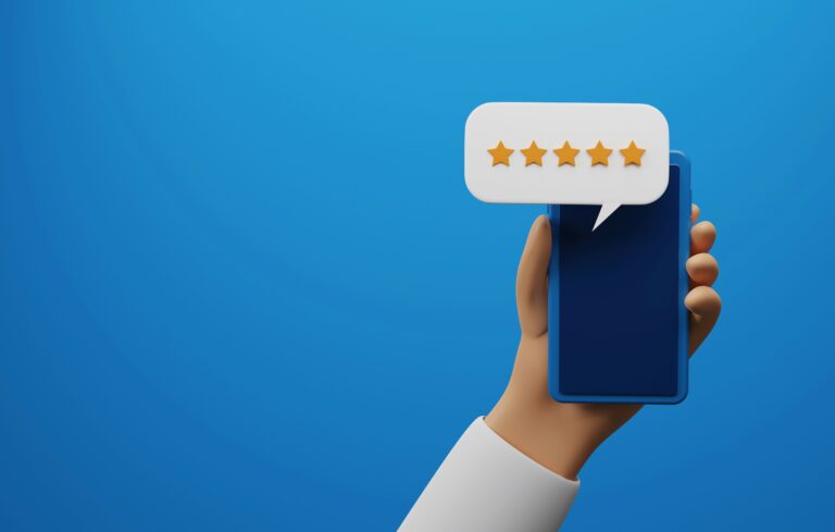 Hand holding phone with a bubble showing five stars to reflect a review